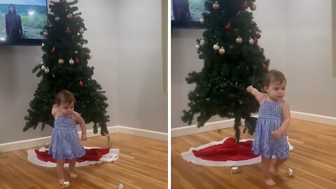 Super strong toddler drags Christmas tree across the room