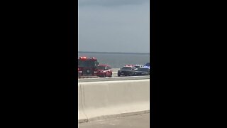 Crews respond to crash that ended with people jumping off the bridge