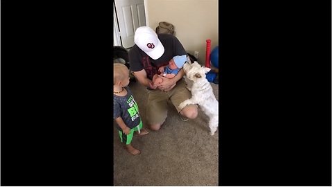 Dog meets newborn baby, steals his hat