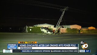 Homes evacuated after car crashes into power pole