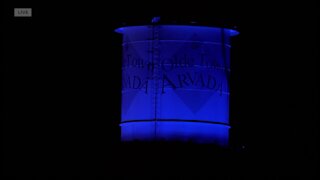 Olde Town Arvada water tower lit in blue to honor fallen officer