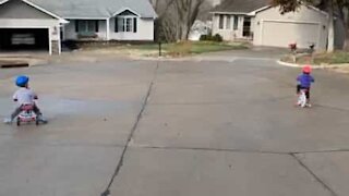 Little girl crashes bike into garage