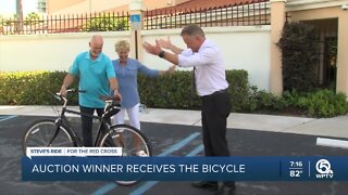 Auction winner receives bicycle from Steve Weagle