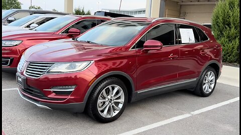 Audrey from Planet Lincoln with a 2015 Lincoln MKC