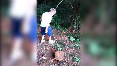 Kid Tries To Chop Slingshot, Gets Slapped In The Face With The Branch