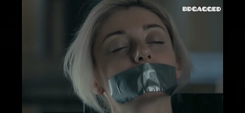 Russian milf with her mouth taped shut