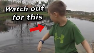 Insanely close call with crocodile when dad with kid go fishing.