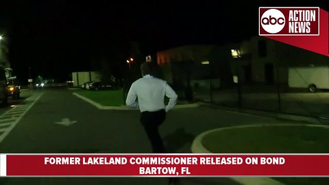 Former Lakeland City Commissioner Michael Dunn runs from reporters after being released from jail on bond