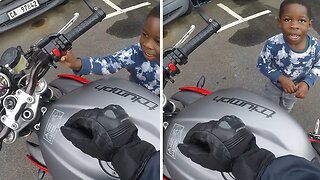 Awesome biker educates and inspires curious boy about bikes