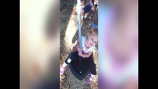 Little Girl gets Dizzy on the Playground