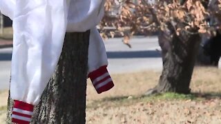 Group ties coats to trees, benches for those in need