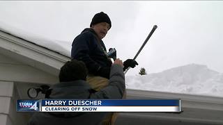 Green Bay neighbors clean up after record breaking snowfall