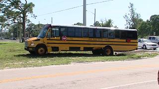 Truck, school bus collide