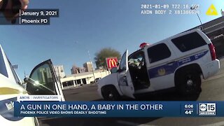 Phoenix police release video of a man shot while holding a baby