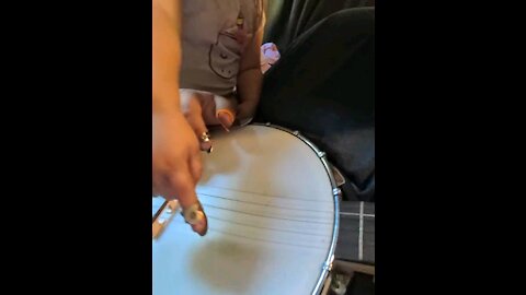 Paisley's (my daughter) first plucks of my banjo