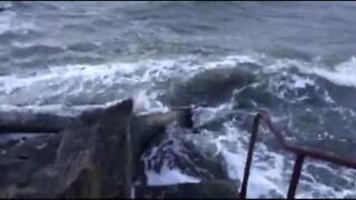 Unfortunate Irish woman is hit by a wave inside the car!