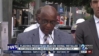 Flashing pedestrian signal beacon installed in Little Italy