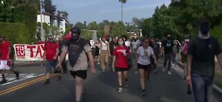 Protestors march on Jeff Bezos mansion