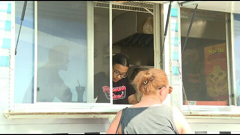 Food trucks workers battle the heat and humidity