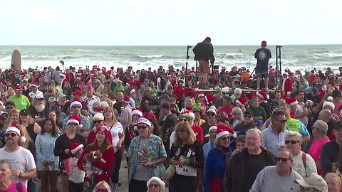 Surfing Santas ride waves, raise funds in Florida