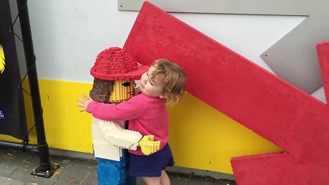 Little Girl Makes Friends With Lego Models At Legoland