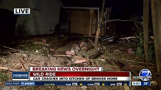 Car crashes through 2 fences, into home in Denver