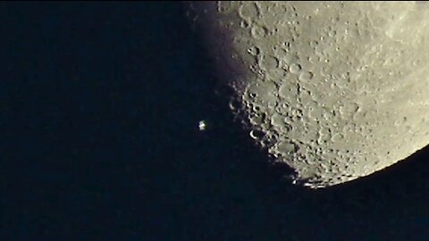 Space Station crosses the Moon