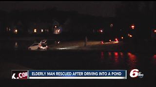 Elderly man drives car into freezing water of a retention pond