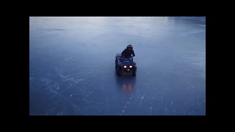 Drone captures ATV riding on a frozen lake in Nova Scotia