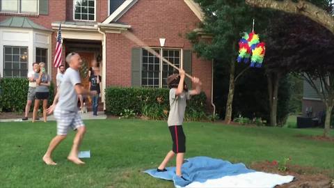 Young Boy Breaks A Piñata And Runs Away With It