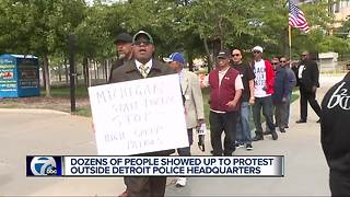 Dozens of people protest outside Detroit police headquarters