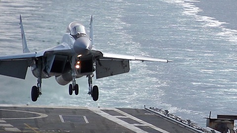 Slow Motion Footage Of Jet Fighter Landing Onto Aircraft Carrier