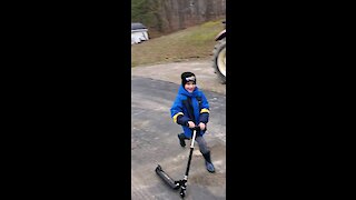 My boy and his scooter.