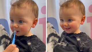 Baby absolutely loves brushing his teeth