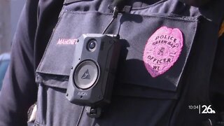 Green Bay PD officers wearing pink badges to support breast cancer awareness