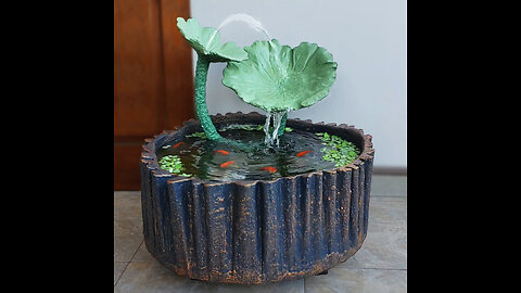 Very simple! use the bike rim to make a wonderful waterfall aquarium