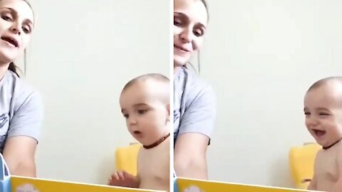 Baby laughs wildly as he sees his mommy imitating animals