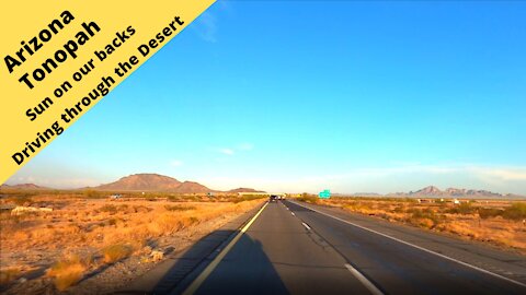 Arizona Tonopah Driving in the desert with the sun setting at our backs 1