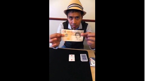 Magician makes playing card penetrate £10 bill