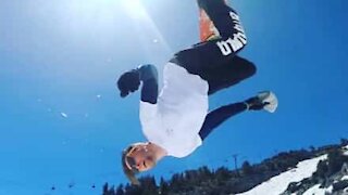 Snowboarder does double somersault but lands wrong