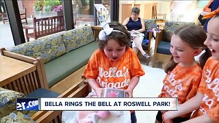 Isabella Phelan rings the victory bell at Roswell Park