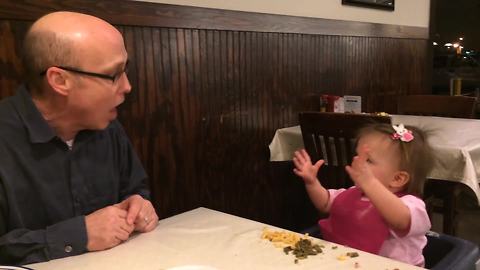 "A Man Talks to A Tot Girl in A Restaurant"