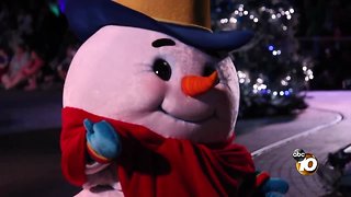 Seasonal cheer dances down Main Street in Disneyland's holiday parade