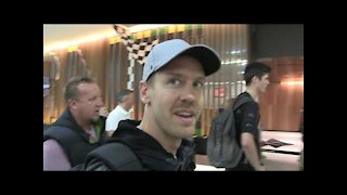 'Ferrari's Sebastian Vettel laughs with fans in Melbourne' |