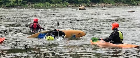 A Boat Rollover in White Water Rafting