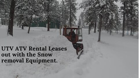 Snow is so heavy we have to use the dozer to push it out of the way.