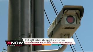 Red light tickets at clogged intersection