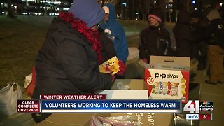 Volunteers hand out supplies to homeless amid bitter cold