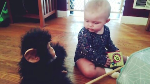 Cute baby being played by toys. 👶