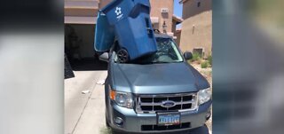 Dust devil tosses trash can into windshield